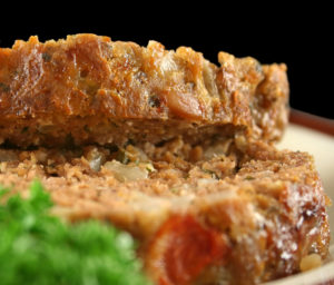 Home style lamb meatloaf with salad ready to serve.
