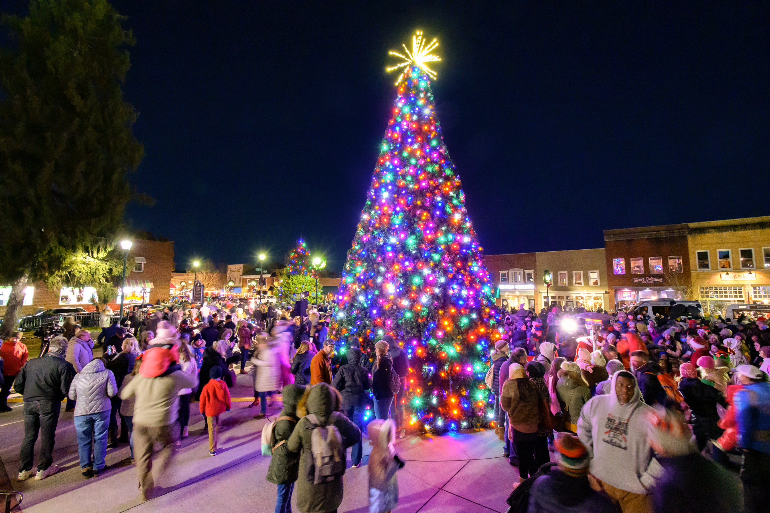Families gather for the Hendersonville NC downtown tree lighting ceremony during Home for the Holidays 2025.