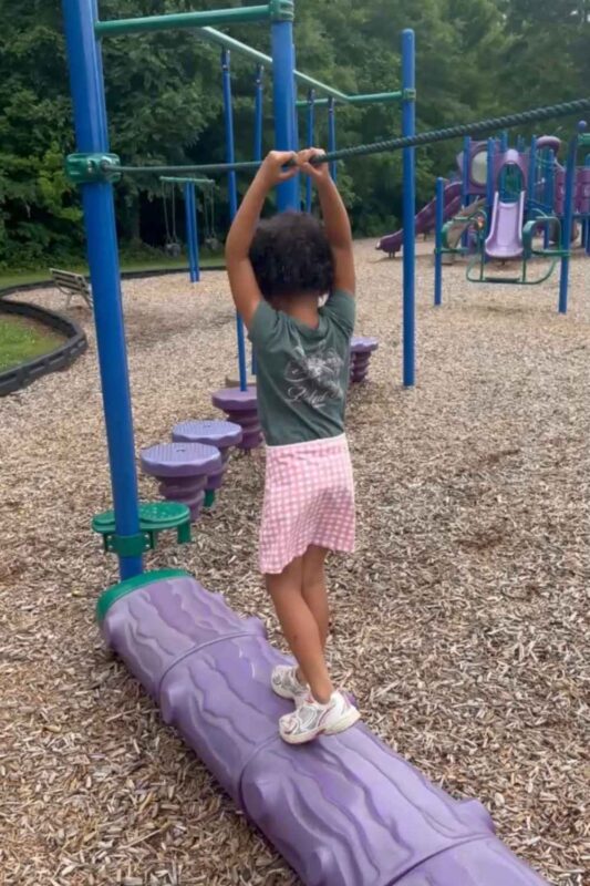 Girl playing on playground Northeast Park in Gibsonville NC