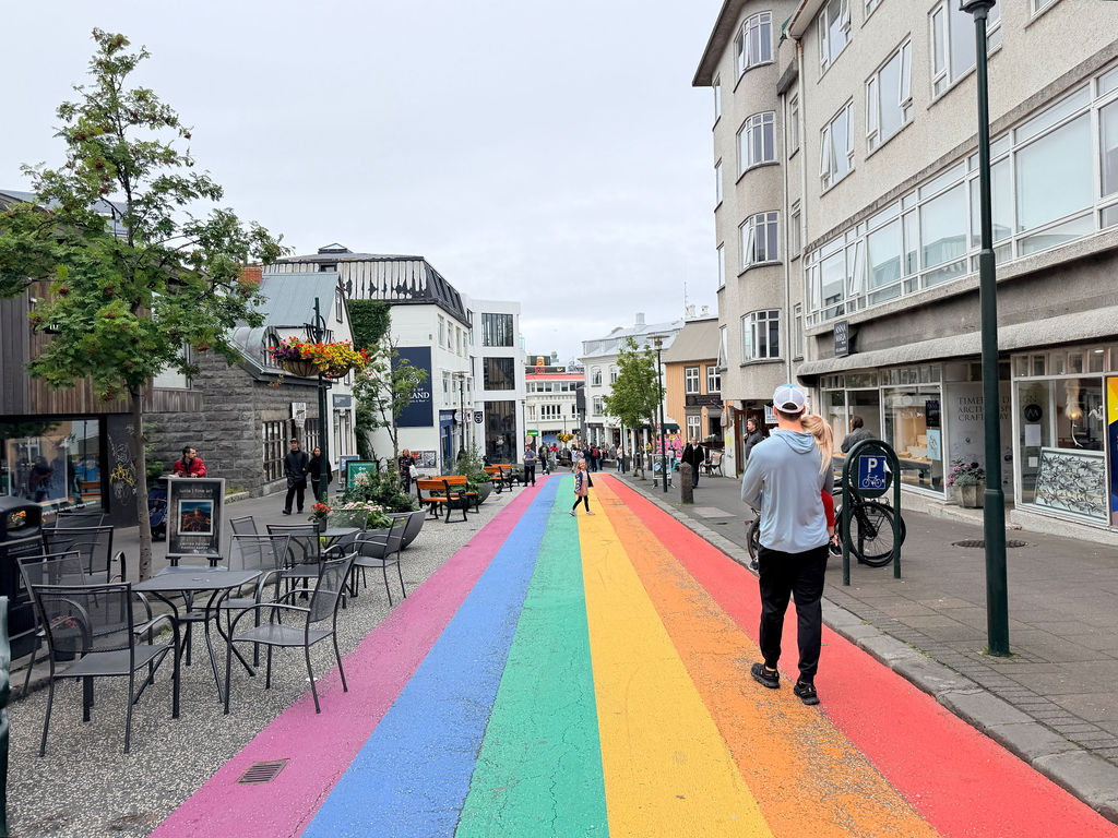 People waking on Rainbow Street in reykjavik