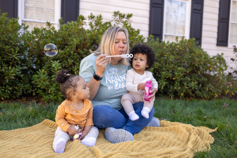 Nanny blowing bubbles