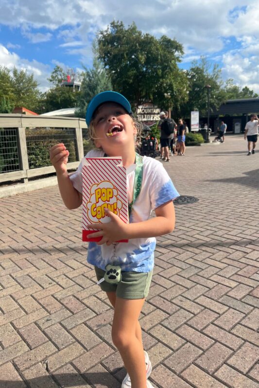 trick or treat carowinds kid having a good time with popcorn